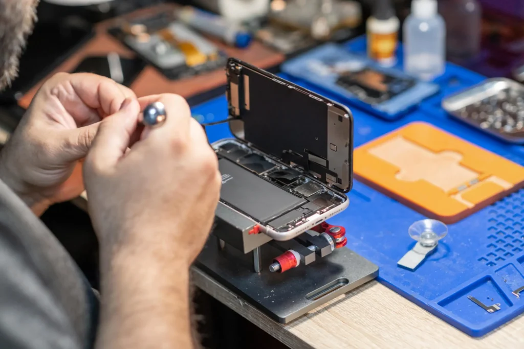 Skilled technician performing phone repair, Techbros Computer Repair